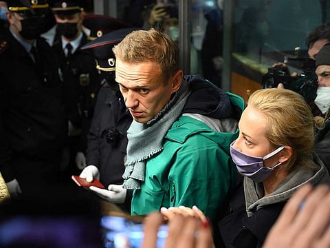 Russian opposition leader Alexei Navalny and his wife Yulia are seen at the passport control point at Moscow's Sheremetyevo airport on January 17, 2021. 