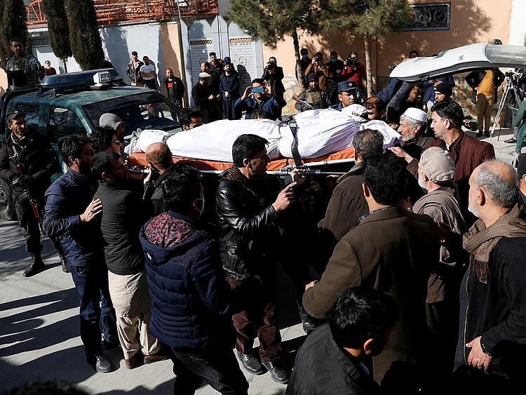 Relatives carry the body of one of the female judges