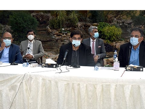 Sindh Chief Minister Syed Murad Ali Shah speaks at a press conference at Chief Minister House along with Federal Planning and Development Minister Asad Umar.
