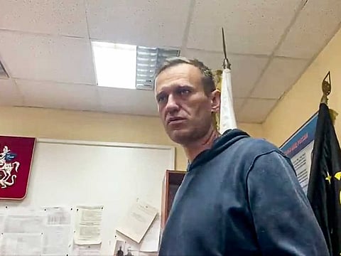In this image taken from video, Russian opposition leader Alexei Navalny gestures as he waits for a court hearing in a police station in Khimki, outside in Moscow, Russia, Monday, Jan. 18, 2021. 