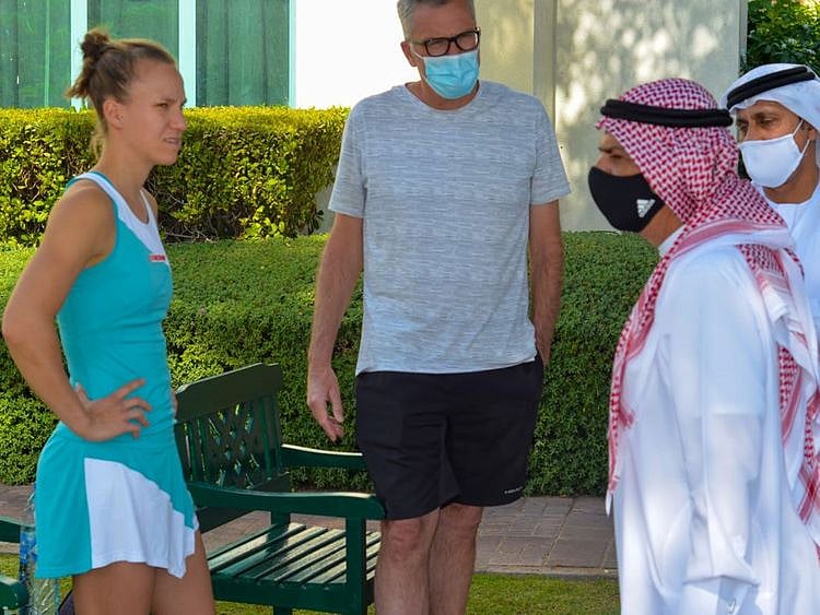 Abdul Ghafoor Behroozian, Chairman of the Fujairah Tennis and Country Club, speaks with a competitor at the Fujairah International Women Tournament 