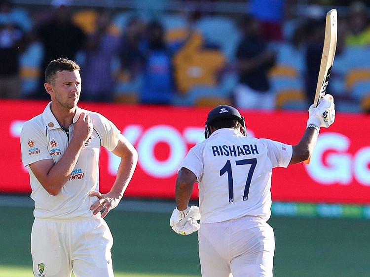 Australia's Josh Hazlewood reacts as India's Rishabh Pant