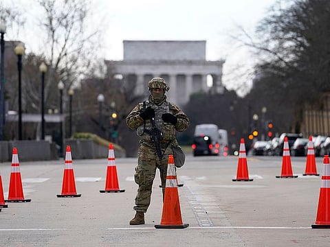 A National Guard stands at a road block near the Supreme Court ahead of President-elect Joe Biden's inauguration ceremony, Wednesday, Jan. 20, 2021, in Washington.