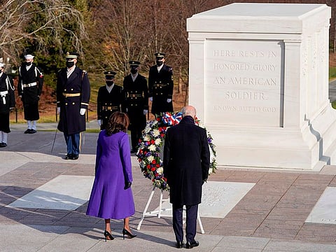 US President Joe Biden and Vice President Kamala Harris lay a wreath at the Tomb of the Unknown Soldier in Arlington Cemetery in Arlington, Virginia, after being sworn in, on January 20, 2021.