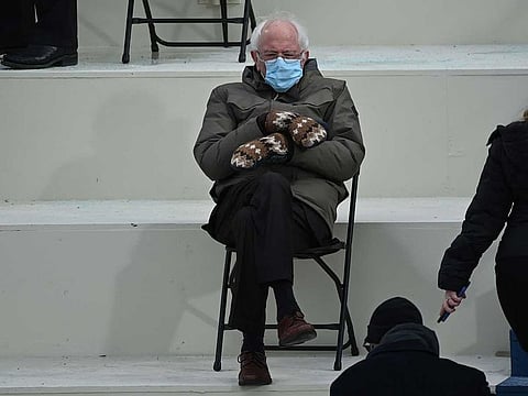 Former presidential candidate, Senator Bernie Sanders (D-Vermont) sits in the bleachers on Capitol Hill before Joe Biden is sworn in as the 46th US President on January 20, 2021, at the US Capitol in Washington, DC. Bernie Sanders’ mittens and memes have helped raise $1.8 million for charity.