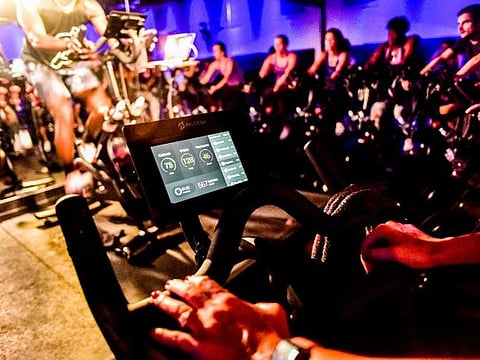 An indoor cycling class for Peloton in New York, Sept. 8, 2016. The bike’s tablet has a built-in camera and microphone, allowing users to see and hear one another if they choose. 