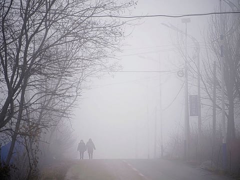 Rescue workers walk on a road leading to the Hushan gold mine, where workers are trapped underground after the January 10 explosion, in Qixia, Shandong province, China January 21, 2021.