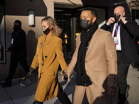 Chrissy Teigen and John Legend leave their hotel during 59th Presidential Inauguration, Wednesday, Jan. 20, 2021, in Washington.