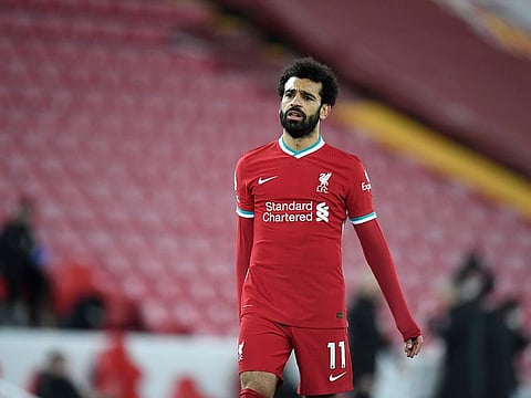 Liverpool's Mohamed Salah walks dejected after the defeat to Burnley.