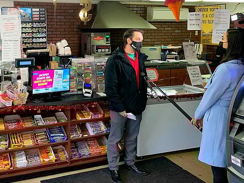 Customers being interviewed at the Coney Market in Lonaconing Md., Thursday, Jan. 21, 2021, where a jackpot-winning Powerball ticket worth $731 million was sold this week.