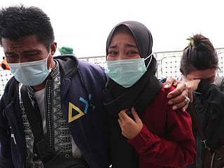 Photos: Families of Indonesia jet crash victims hold memorial at sea