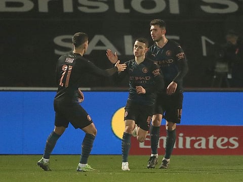 Manchester City's Phil Foden celebrates the leveller against Cheltenham Town 