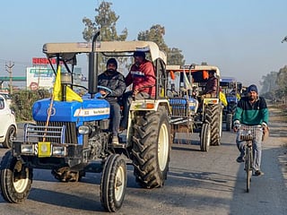 In pictures: Indian farmers ride caravan of tractors into New Delhi ahead of Republic Day 