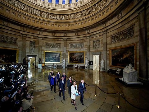 House Sergeant at Arms Paul Irving and House Clerk Cheryl Johnson carry two articles of impeachment against US President Donald Trump during a procession with the seven House impeachment managers through the Rotunda of the US Capitol to the US Senate in Washington, US, January 15, 2020. 