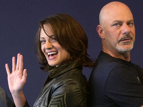 In this file photo taken on September 07, 2002 Italian actress Asia Argento poses with US director Rob Cohen during the 28th American Film Festival of Deauville before the screening of Cohen's film "XXX".