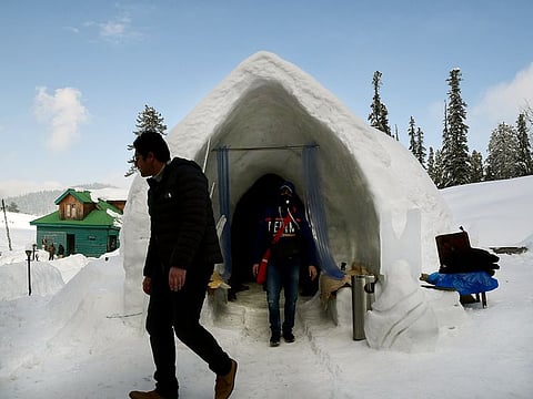 Tourists come out from the first Igloo Cafe at Gulmarg near Srinagar.
