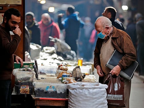Lebanese shop at a market in the Lebanese coastal city of Tripoli, north of Beirut. Lebanon is battling its worst economic crisis since the 1975-1990 civil war. The national currency is in free fall, while poverty and unemployment are on the rise.