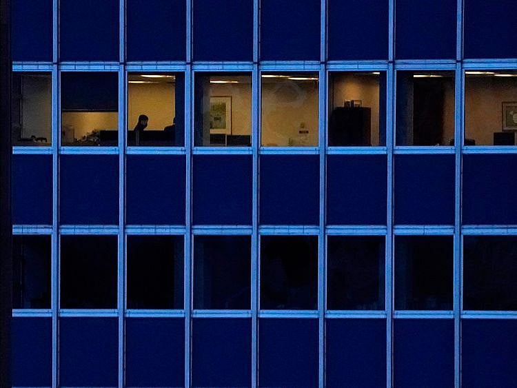 Employees work in an office building  in Midtown New York City. 