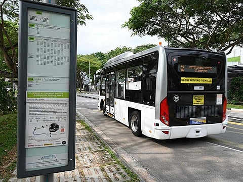 An autonomous bus developed by ST Engineering departs from bus stop after picking up passengers at the start of a trial run from Singapore Science Park 2 to Haw Par Villa MRT station in Singapore.