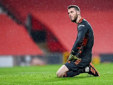 Manchester United's goalkeeper David de Gea reacts after Sheffield United's Oliver Burke scored his team's second goal on Wednesday, January 27, 2021. 