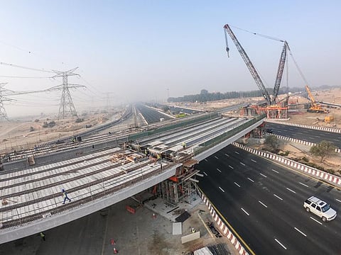  Construction of the bridge linking Al Khawaneej Road with Al Awir continues in full swing. 