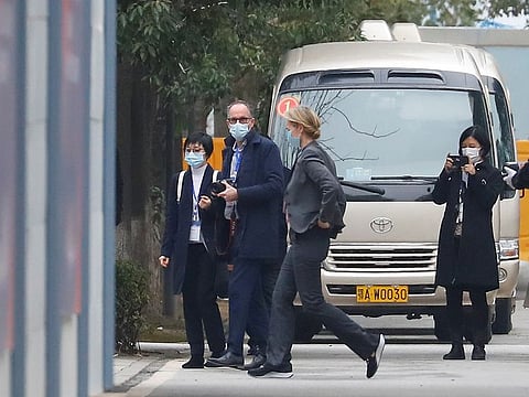 Members of the World Health Organisation (WHO), tasked with investigating the origins of COVID-19, Thea Fischer and Peter Ben Embarek walk outside Jinyintan Hospital in Wuhan, on January 30, 2021. 