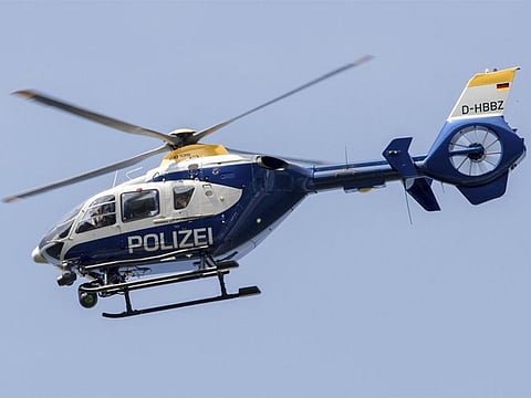 File photo: A police helicopter flying over the A12 motorway near Briesen, Germany. [Illustrative image]  