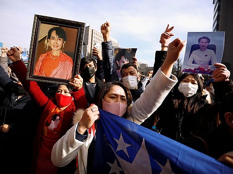 Myanmar protesters residing in Japan hold photos of Aung San Suu Kyi as they rally against Myanmar's military after seizing power from a democratically elected civilian government and arresting its leader Aung San Suu Kyi, at United Nations University in Tokyo, Japan.