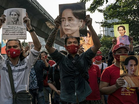 Supporters of Aung San Suu Kyi rally outside the embassy of Myanmar in Bangkok, Thailand.