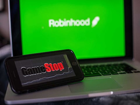 Retail brokerage Robinhood said on Friday US regulators were looking into its temporary trading curbs on so-called meme stocks earlier this year as shares of companies like GameStop Corp soared.