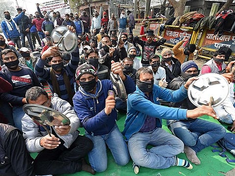 Candidates who have qualified for the Secondary Teachers Eligibility Test (STET) protest for permanent jobs, in Patna on Tuesday, February 2, 2021. 