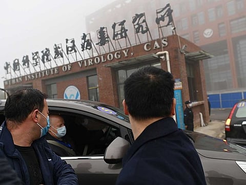 Members of the World Health Organisation (WHO) team investigating the origins of the COVID-19 coronavirus arrive by car at the Wuhan Institute of Virology in Wuhan in China's central Hubei province on February 3, 2021. 