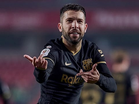 Barcelona's Jordi Alba celebrates after scoring his side's fifth goal during their Spanish Copa del Rey quarter finals against Granada at the Los Carmenes Stadium in Granada, Spain, on Wednesday.