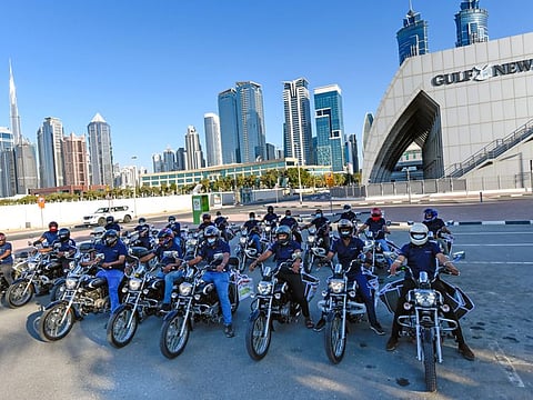 Gulf News distribution staff on the new bikes outside the Gulf News office in Dubai