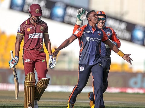 Dwayne Bravo (centre), the Delhi Bulls captain, exults after claiming the wicket of prolific Nicholas Pooran of Northern Warriors.