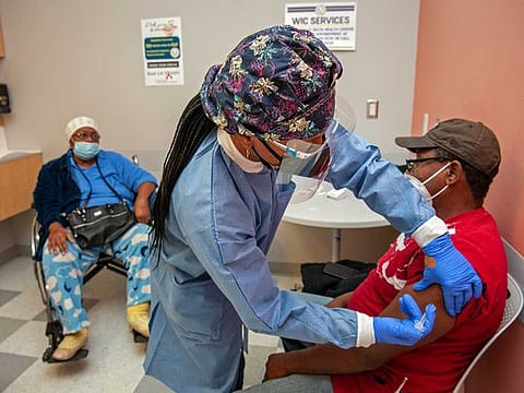 Tara Gallion administers the Moderna COVID-19 vaccine to Eddie Williams at the Delta Health Center in Mound Bayou, Miss,. January 30, 2021. 