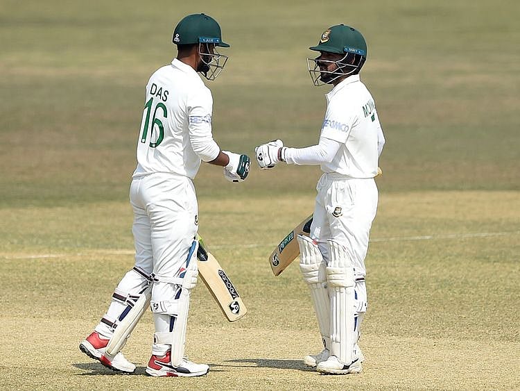 Bangladesh's Liton Das with his captain Mominul Haque during the fourth day of the first cricket Test match between against West Indies