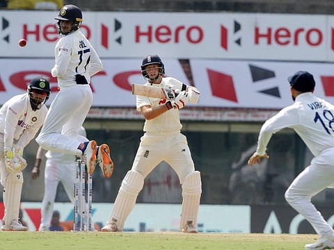 England captain Joe Root cuts this one firecely as close-in fielder Shubhman Gill takes evasive action en route to his fifth double century on Saturday.