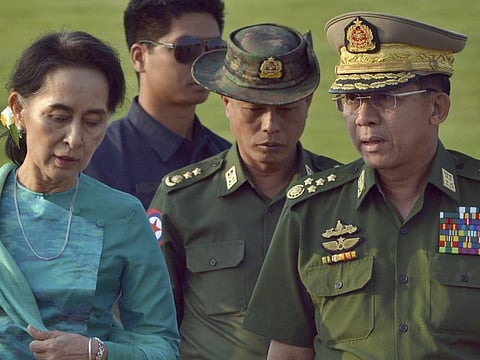 Aung San Suu Kyi with senior General Min Aung Hlaing in the file 2016 picture. There's no love lost between the two Buddhist, ethno-nationalists from the Bamar ethnic minority. 