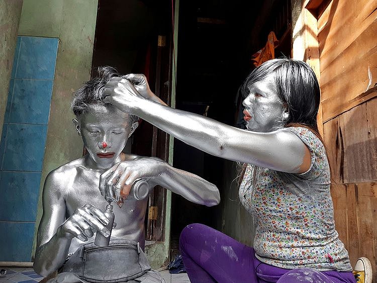 2021-02-08T103902Z_353632985_RC29OL9PIFV8_RTRMADP_3_INDONESIA-SILVER-PEOPLE-(Read-Only)