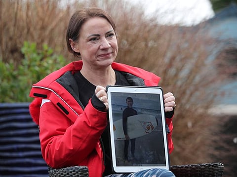 Sally Flavill shows a photograph of her nephew Joseph Flavill, who has awoken from a coma with no knowledge of the COVID-19 pandemic after he was injured in a car accident in March 2020, during an interview in Nottingham, Britain, February 5, 2021. 