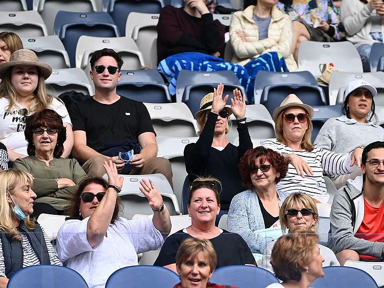 Fans watch the first round match between Canada's Bianca Andreescu and Romania's Mihaela Buzarnescu. 