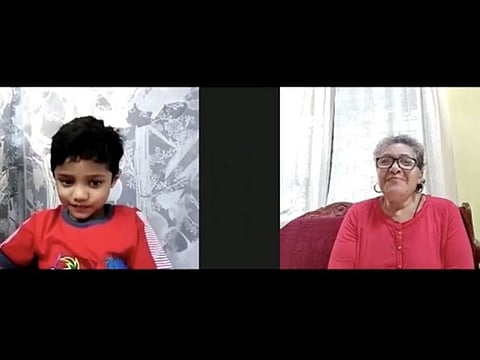 A child with her grandmother during the virtual session.