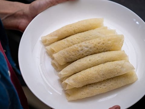 Patishapta or light crepes with a coconut and jaggery filling 