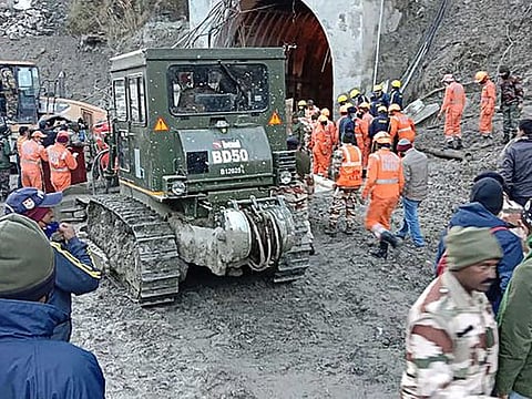 This handout photo taken on February 8, 2021 and released by the Indo-Tibetan Border Police (ITBP) shows members of the Indo-Tibetan Border Police (ITBP) during a rescue operation after a broken glacier caused a major river surge that swept away bridges and roads, at a tunnel near Tapovan dam in Chamoli district of Uttarakhand. 