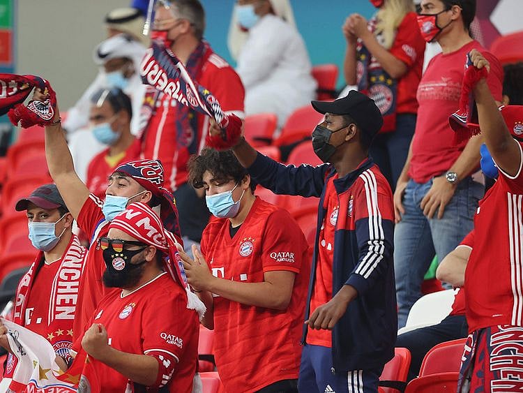 Bayern Munich supporters cheer during the Fifa Club World Cup semi-final against Egypt's Al-Ahly at the Ahmed bin Ali Stadium in the Qatari city of Ar-Rayyan 