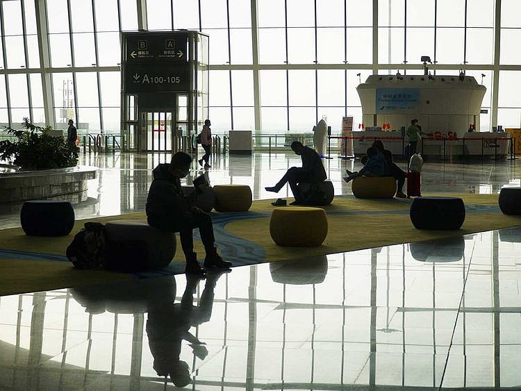 Passengers wait for a flight at Daxing Airport in Beijing on February 8, 2021, ahead of Lunar New Year, which falls on February 12.