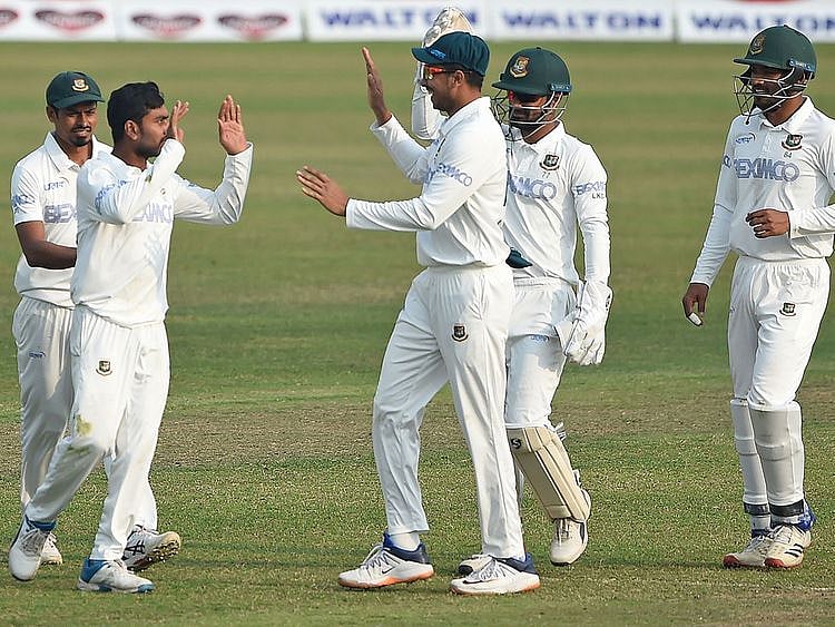 Bangladesh's cricketers celebrate after the dismissal of West Indies' Shayne Moseley 