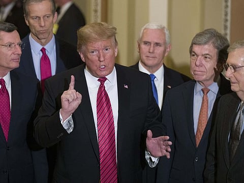 In this January 9, 2019 file photo, Sen. John Barrasso, left, and Sen. John Thune, stand with President Donald Trump, Vice President Mike Pence, Sen. Roy Blunt, and Senate Majority Leader Mitch McConnell as Trump speaks while departing after a Senate Republican Policy luncheon, on Capitol Hill in Washington. The Republican Party still belongs to Donald Trump. The GOP privately flirted with purging the norm-shattering former president after he incited a deadly riot at the US Capitol last month. But in the end, only seven of 50 Senate Republicans voted to convict Trump in his historic second impeachment trial on Saturday, February 13, 2021. 