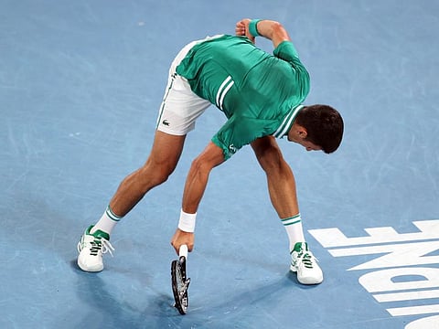 World No.1 Novak Djokovic smashes his racquet in frustration on court during his quarter final match against Germany's Alexander Zverev on Tuesday.